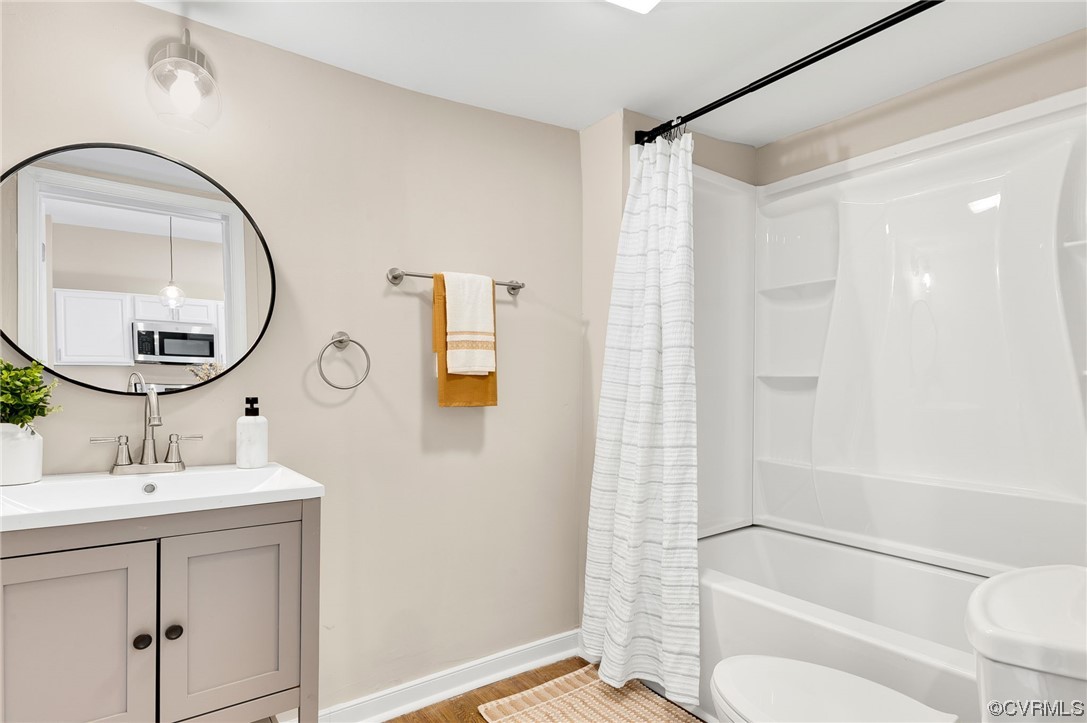 117 Spring Street Petersburg, VA 23803 - Photo 14 of 22 a bathroom with a sink toilet and shower