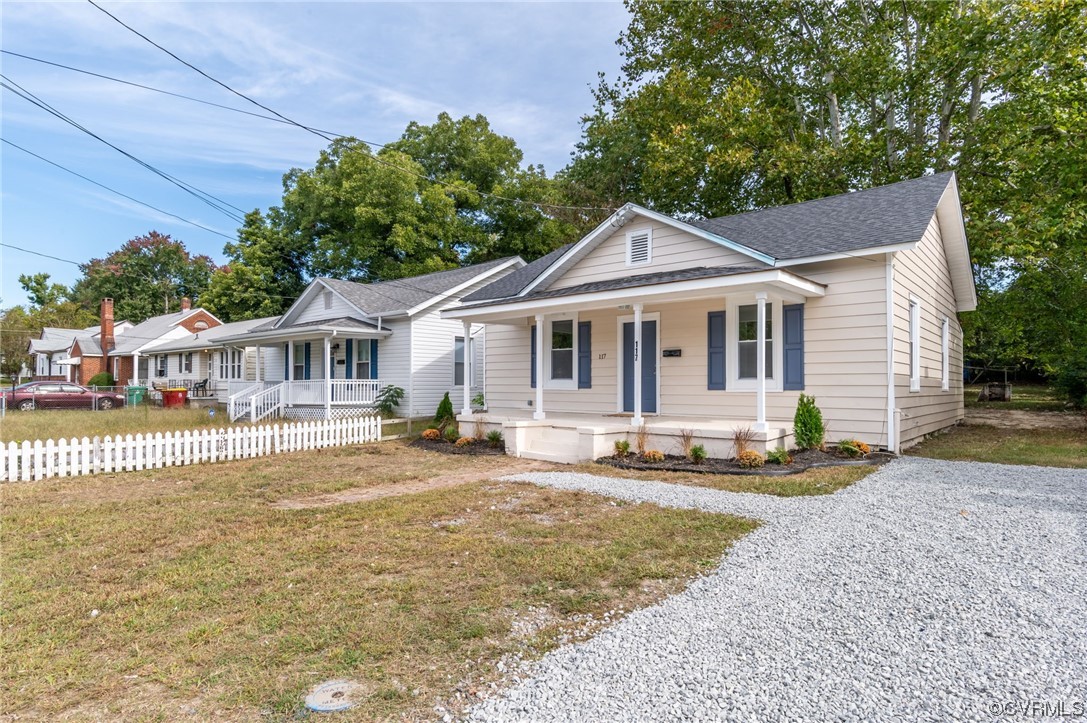 117 Spring Street Petersburg, VA 23803 - Photo 2 of 22 a front view of a house with swimming pool and porch