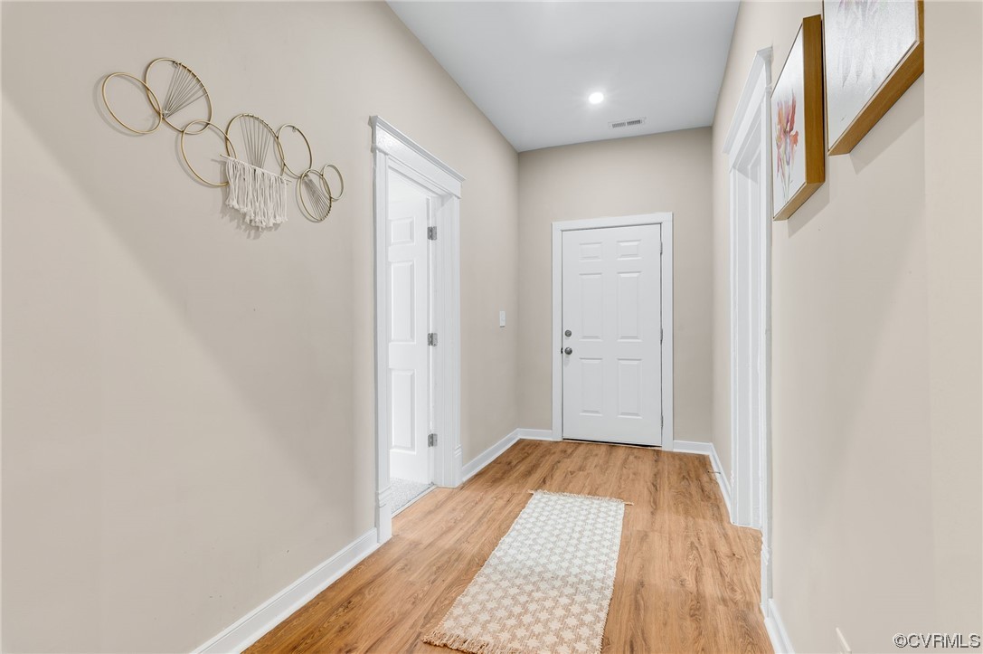 117 Spring Street Petersburg, VA 23803 - Photo 3 of 22 a view of a room with a barbeque and wooden floor