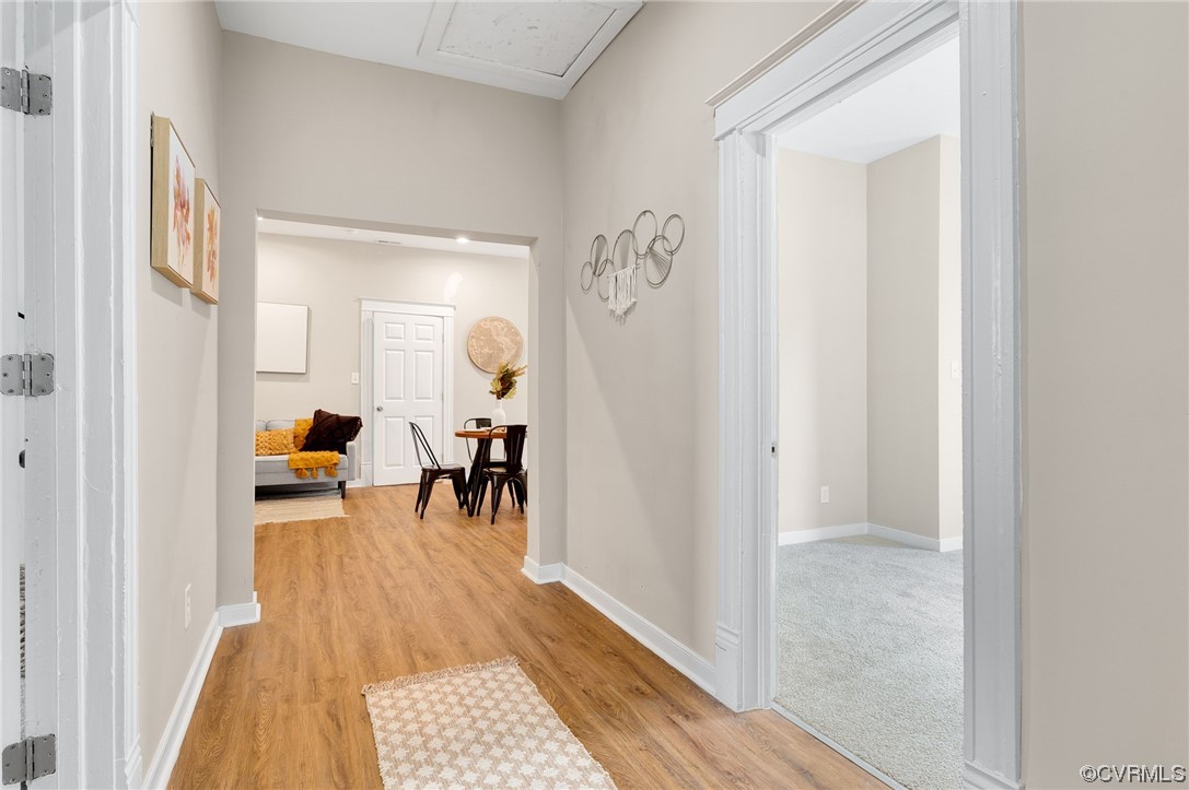 117 Spring Street Petersburg, VA 23803 - Photo 4 of 22 a hallway with a white door and couch
