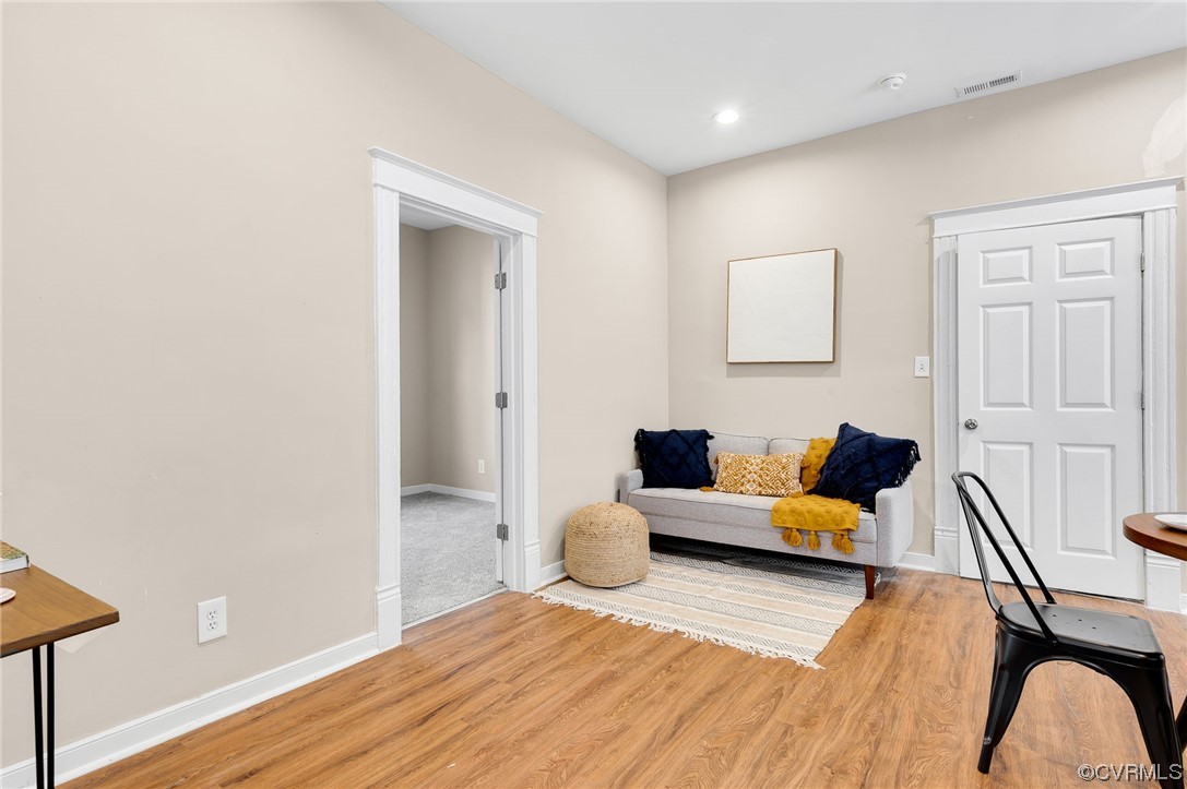 117 Spring Street Petersburg, VA 23803 - Photo 5 of 22 a bedroom with furniture and wooden floor