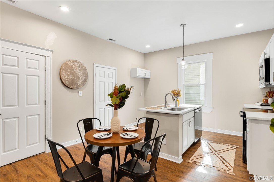 117 Spring Street Petersburg, VA 23803 - Photo 6 of 22 a view of a dining room with furniture and wooden floor