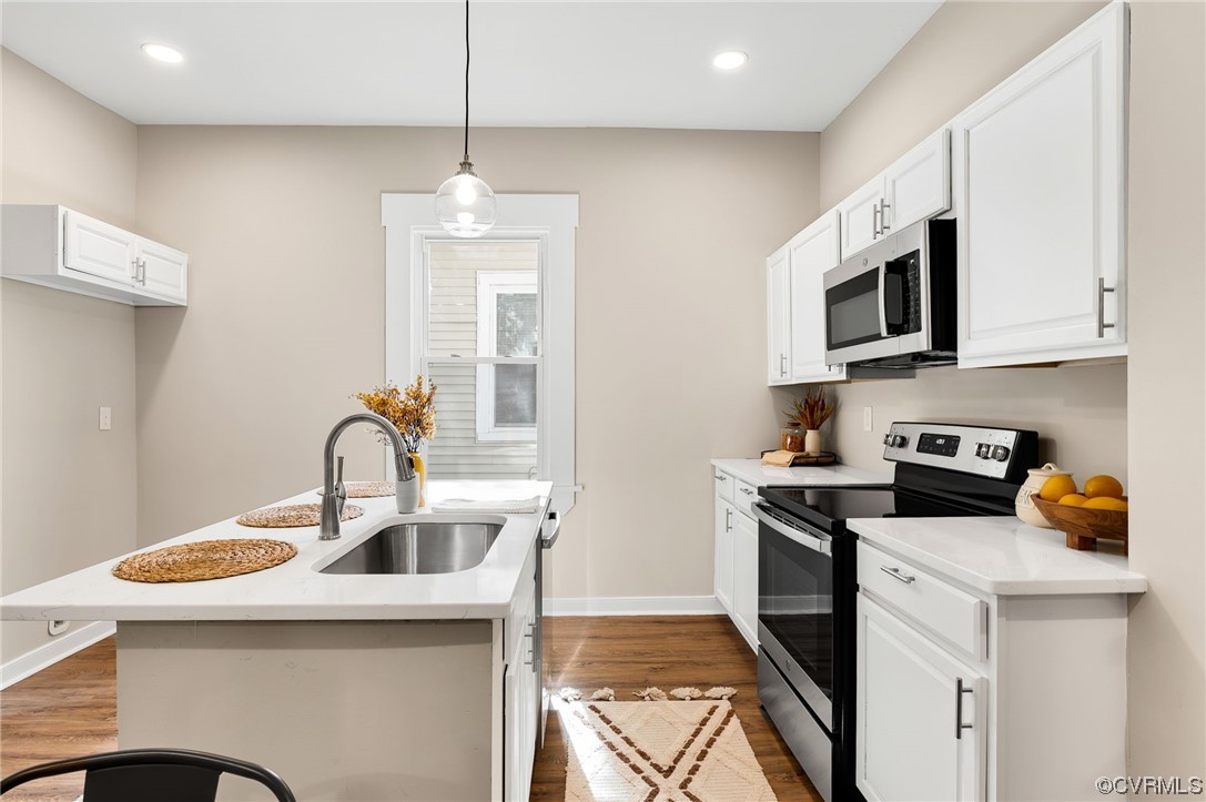 117 Spring Street Petersburg, VA 23803 - Photo 8 of 22 a kitchen that has a sink a stove and microwave
