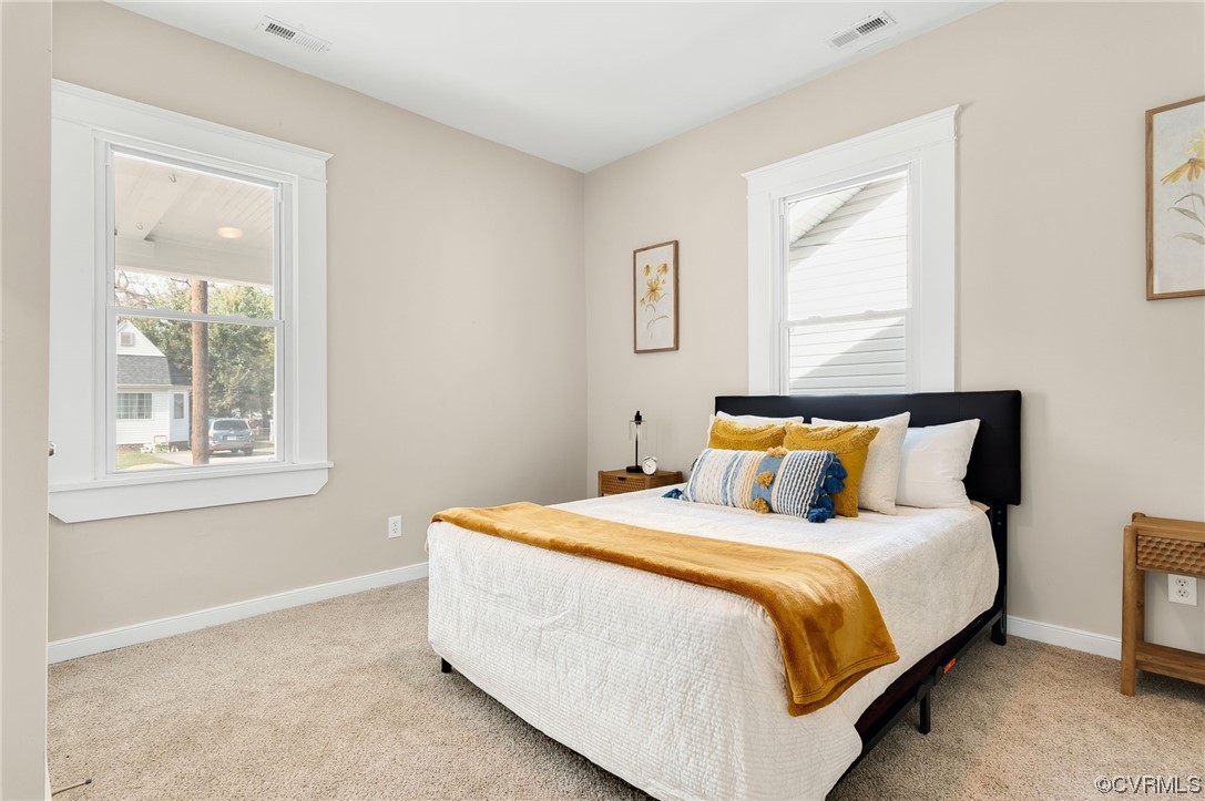 117 Spring Street Petersburg, VA 23803 - Photo 10 of 22 a bedroom with bed and a window
