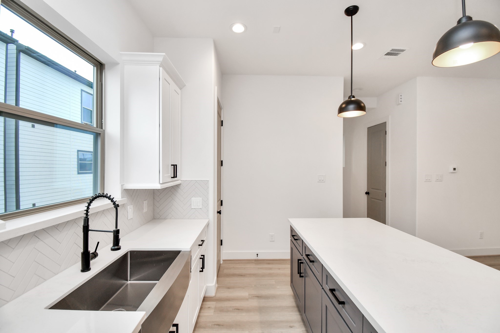 2335 Eagle Street Houston, TX 77004 - Photo 11 of 26 a kitchen with a sink stove and cabinets