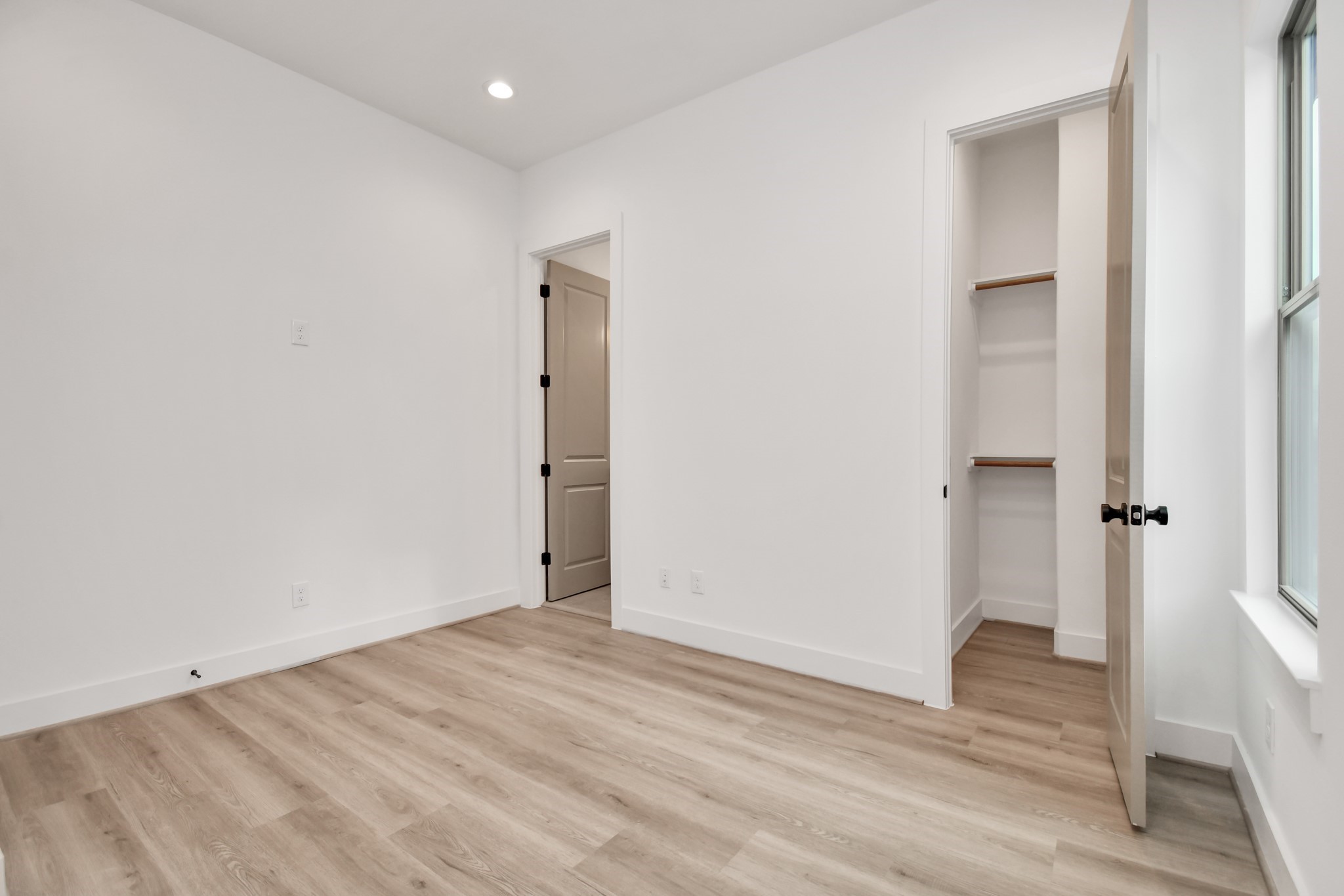 2335 Eagle Street Houston, TX 77004 - Photo 19 of 26 a view of an empty room with wooden floor