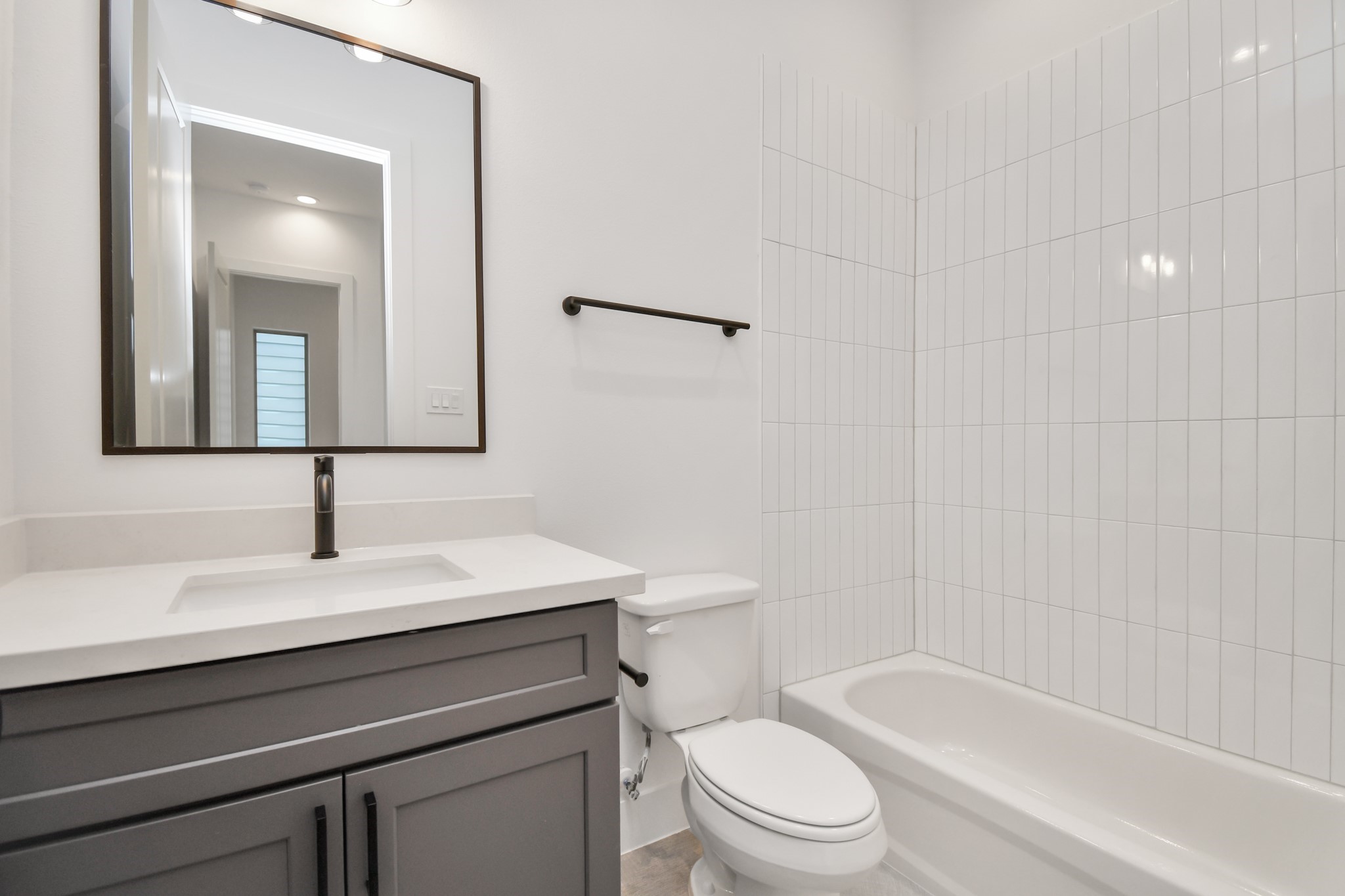 2335 Eagle Street Houston, TX 77004 - Photo 20 of 26 a bathroom with a sink a toilet and shower