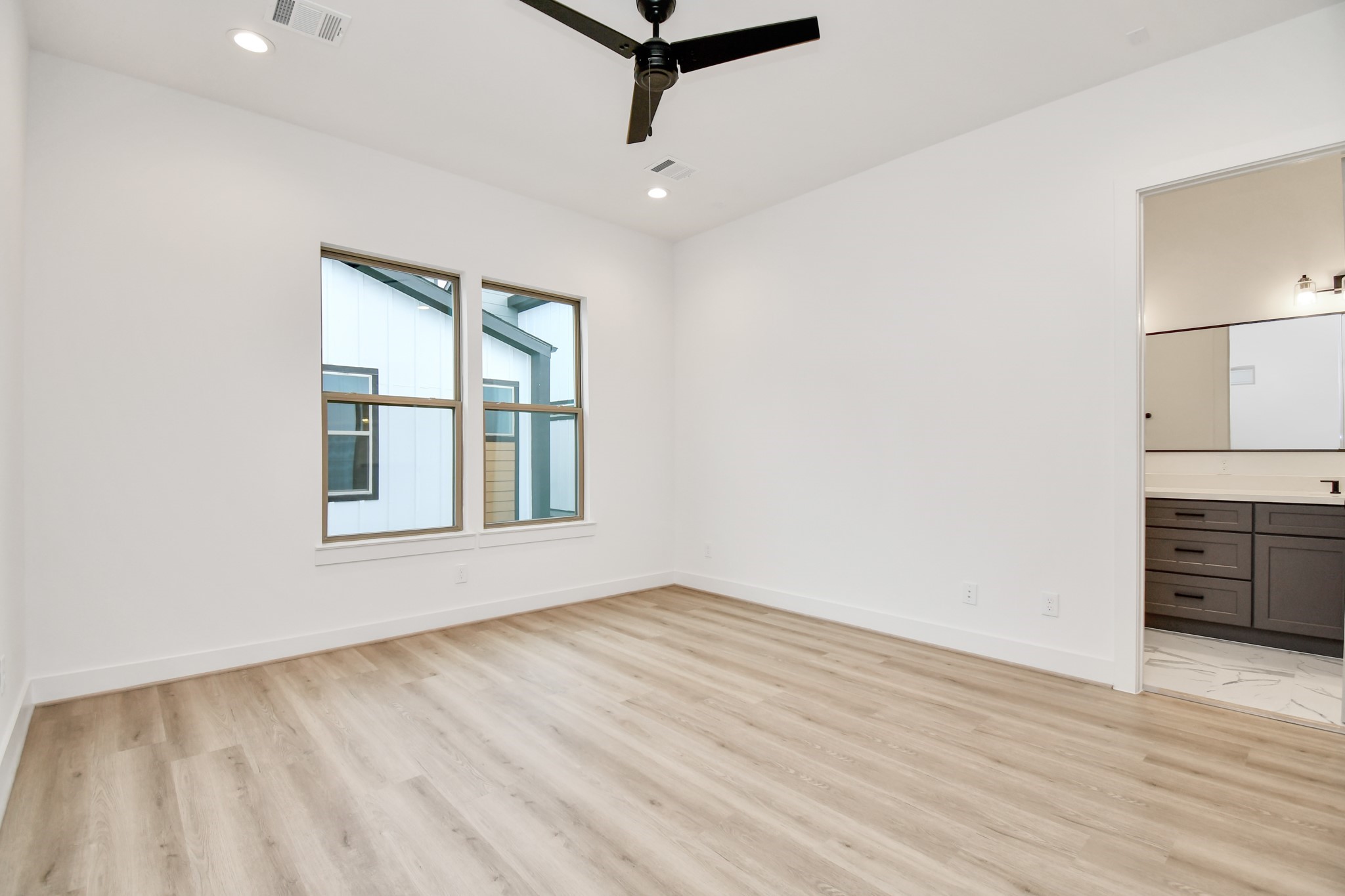 2335 Eagle Street Houston, TX 77004 - Photo 21 of 26 a view of an empty room with window and wooden floor