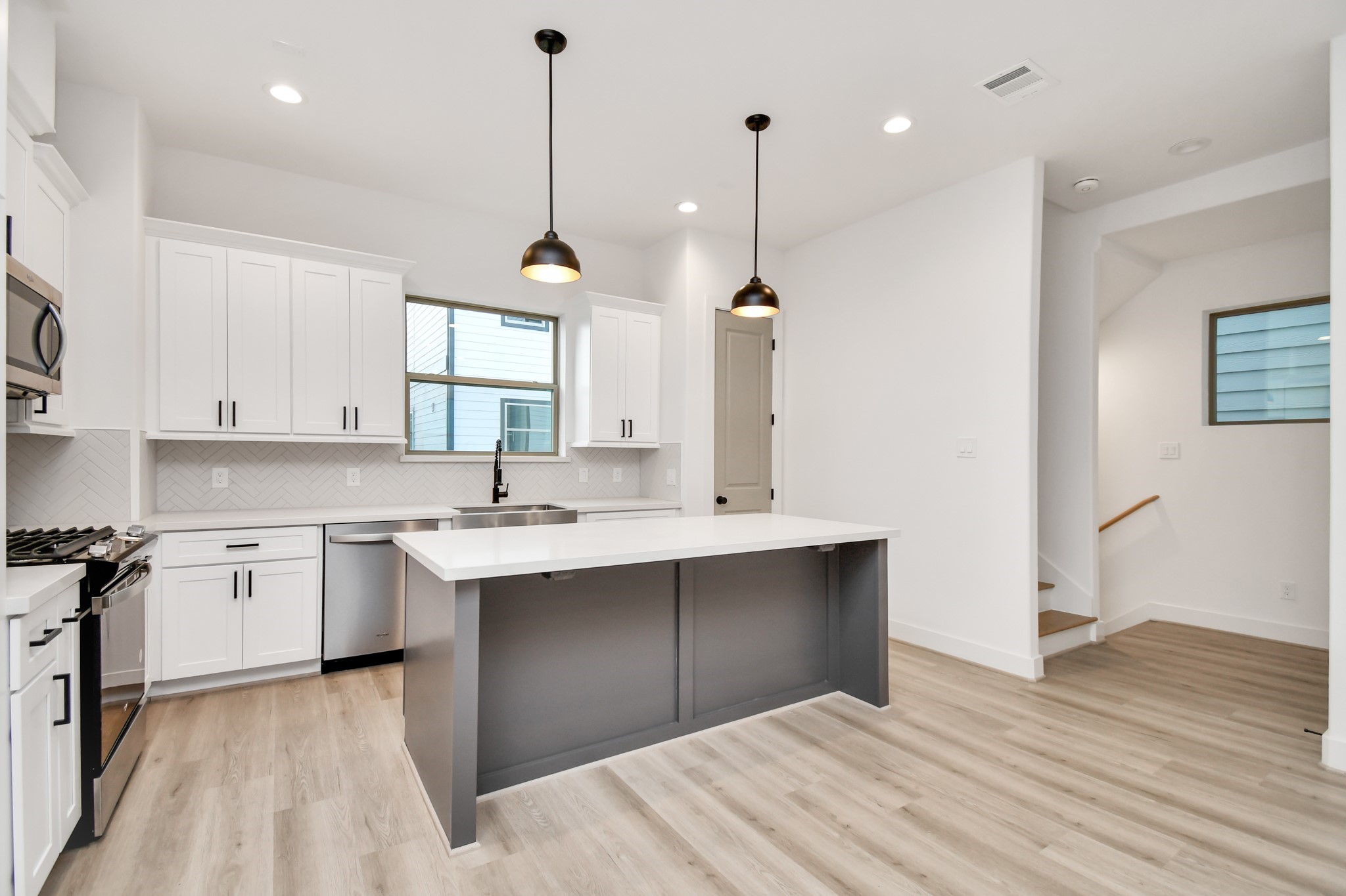 2335 Eagle Street Houston, TX 77004 - Photo 10 of 26 a kitchen with a sink stove and cabinets