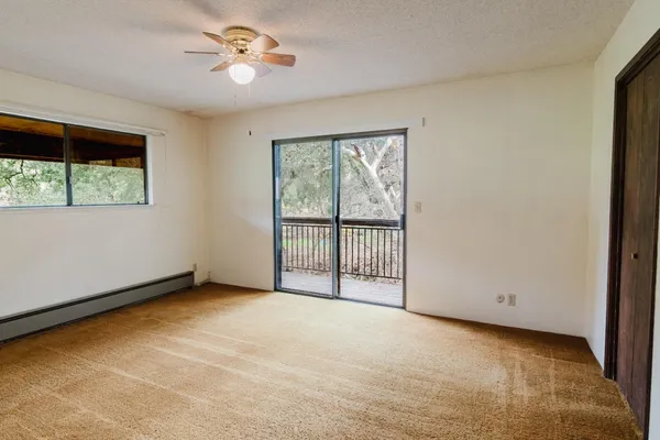 a bathroom with a sink a toilet a shower and a mirror