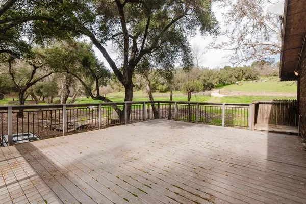 a front view of a house with wooden stairs
