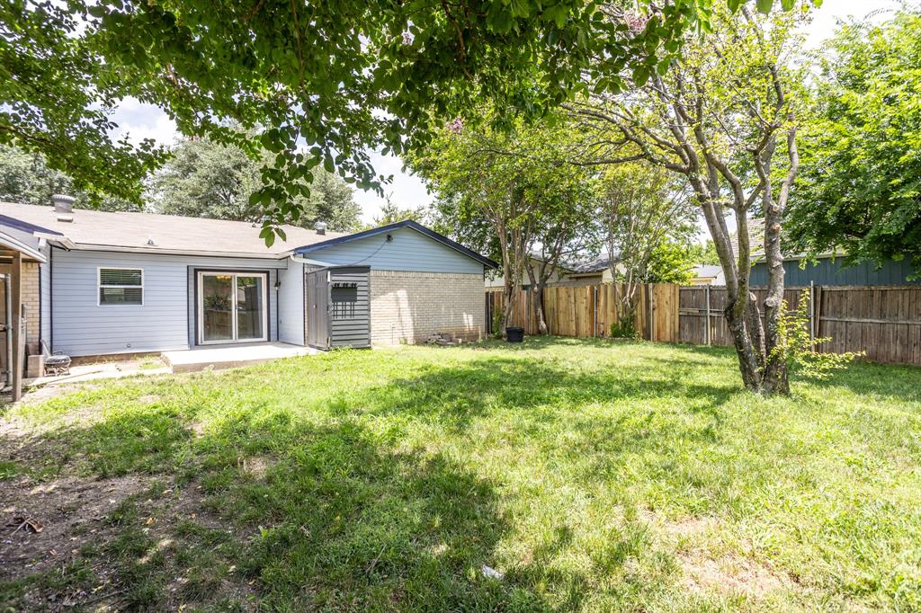 1206 Oakbluff Drive Lancaster, TX 75146 - Photo 21 of 23 Back yard with patio and small storage unite.