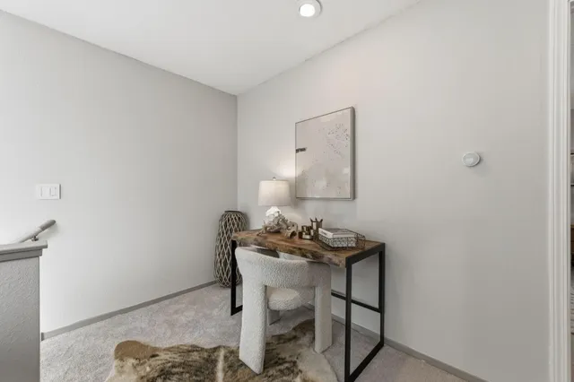 a view of a workspace with furniture