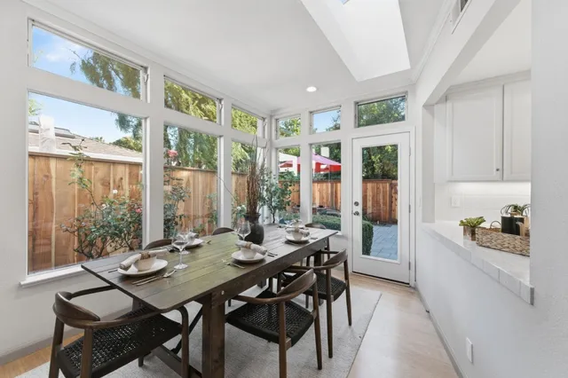 a view of a dining room with furniture window and outside view
