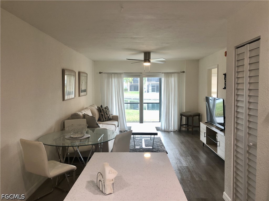 16881 Davis Road, Unit 214 Fort Myers, FL 33908 - Photo 6 of 46 a living room with furniture and a window
