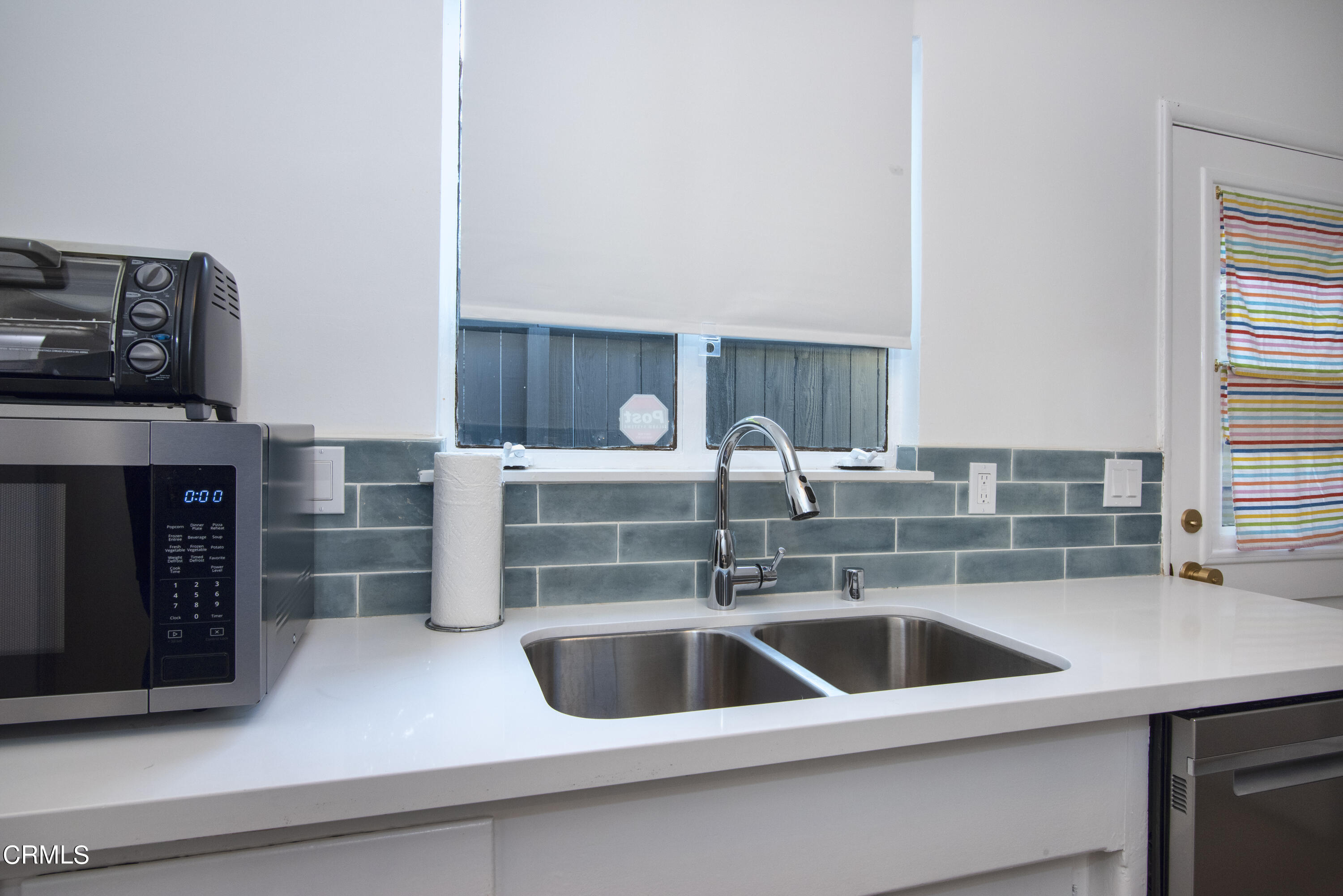 2935 Morningside Street Pasadena, CA 91107 - Photo 18 of 31 a kitchen with a sink and a refrigerator