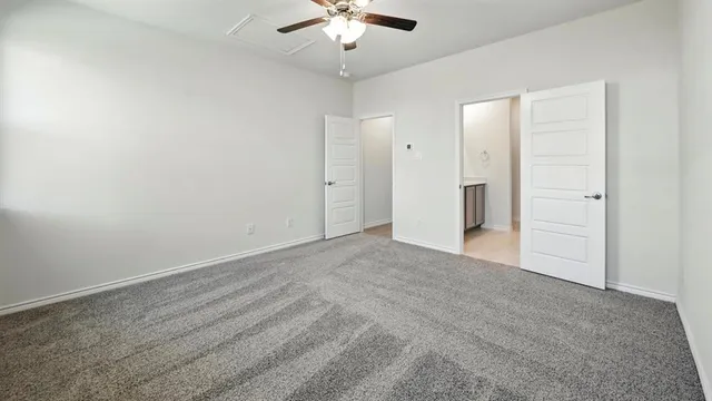 a view of a livingroom with a chandelier fan