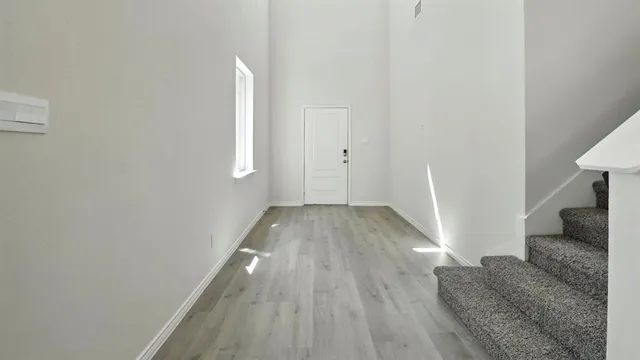 a view of entryway with wooden floor