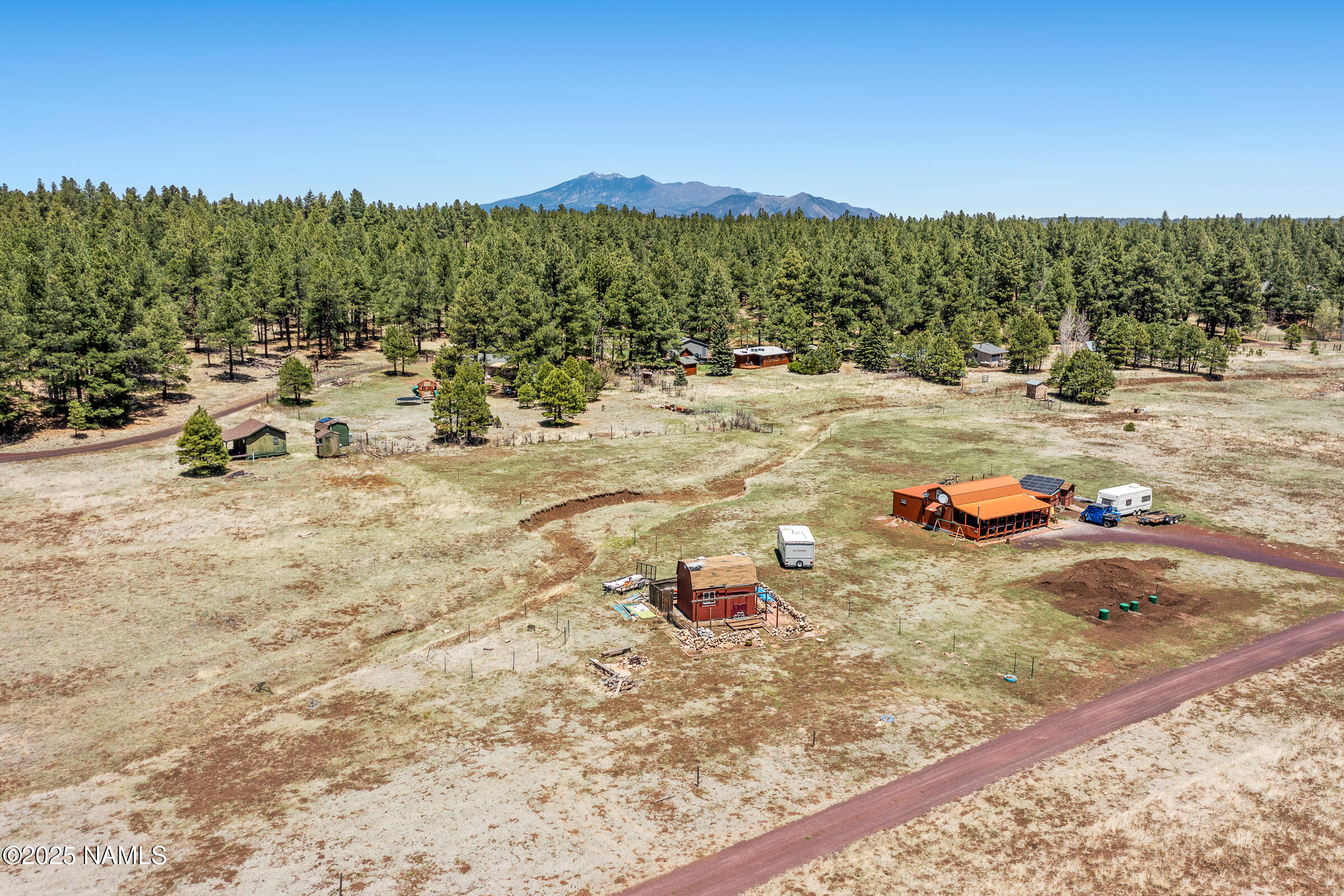 5984 Antelope Road Flagstaff, AZ 86005 - Photo 5 of 12 a view of a lake with a mountain