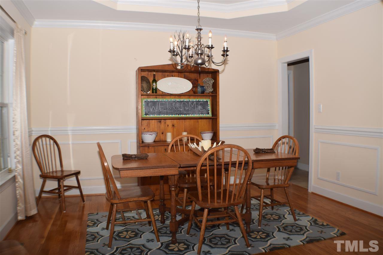 395 Steve Ridge Willow Spring, NC 27592 - Photo 4 of 21 a view of a dining room with furniture and chandelier