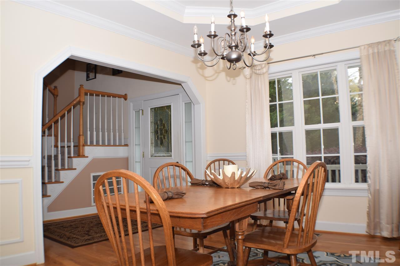 395 Steve Ridge Willow Spring, NC 27592 - Photo 5 of 21 a view of a dining room with furniture wooden floor and chandelier