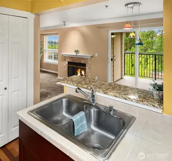 a kitchen with a sink and a refrigerator
