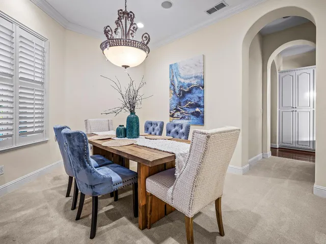 a bedroom with bed and a large window