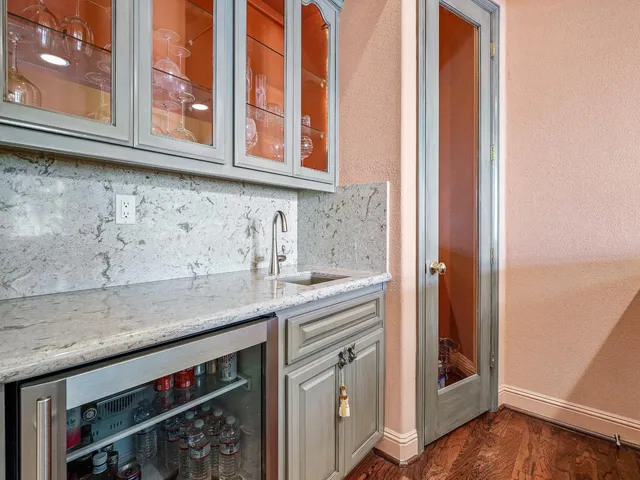 a living room with furniture a couch and a potted plant