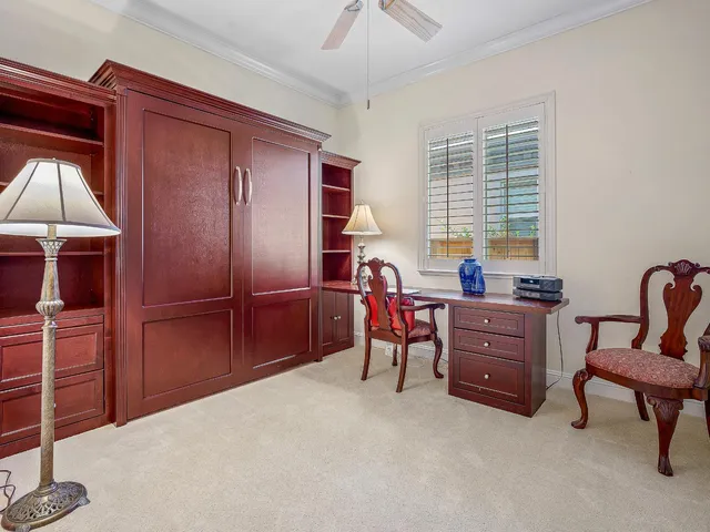 a view of swimming pool with outdoor seating and plants