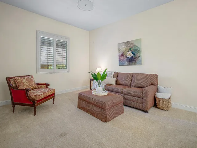 a view of a patio with table and chairs potted plants with wooden floor