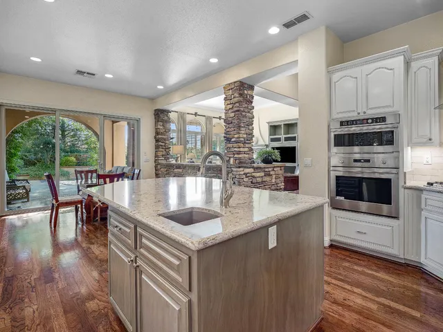 a living room with furniture fireplace and flat screen tv