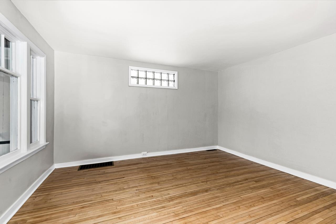 310 3rd Street Cloquet, MN 55720 - Photo 11 of 39 Unfurnished room featuring light wood-type flooring and baseboards