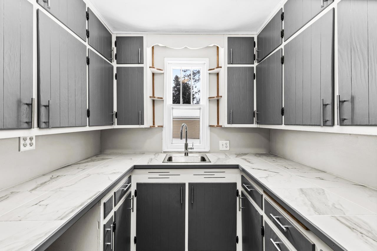 310 3rd Street Cloquet, MN 55720 - Photo 18 of 39 Two tone kitchen with open shelves and dual tone cabinets