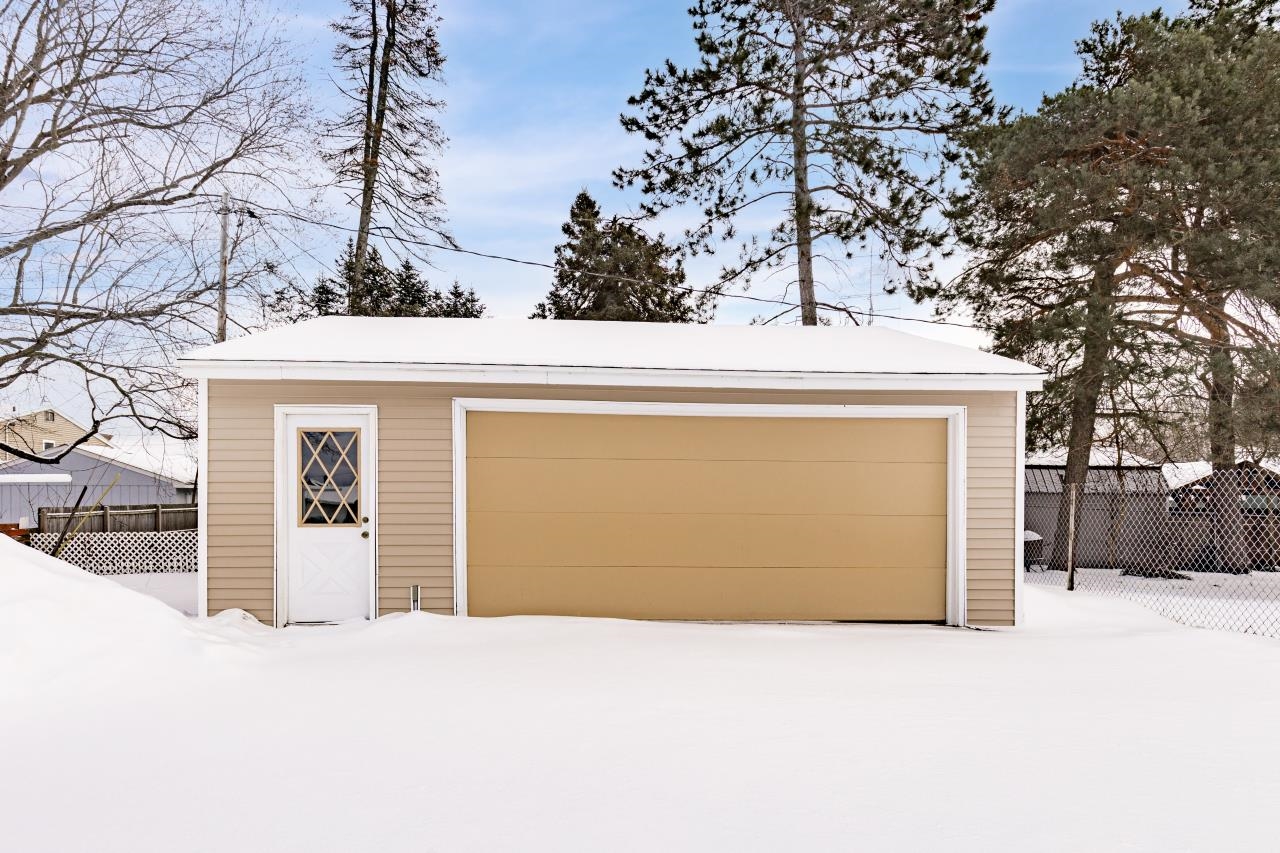 310 3rd Street Cloquet, MN 55720 - Photo 19 of 39 Snow covered garage with a detached garage