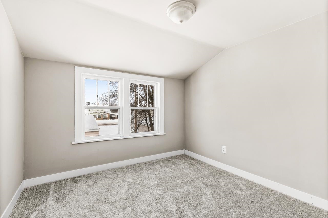 310 3rd Street Cloquet, MN 55720 - Photo 29 of 39 Spare room featuring lofted ceiling and carpet