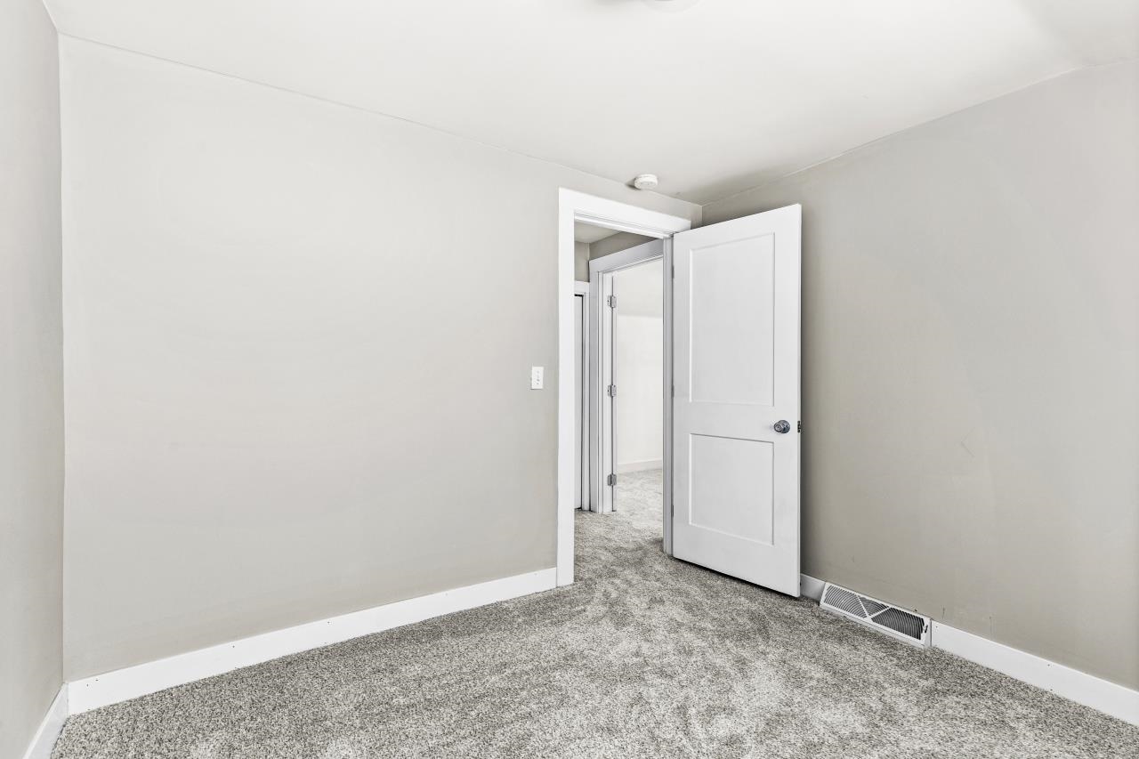 310 3rd Street Cloquet, MN 55720 - Photo 30 of 39 Carpeted spare room with baseboards