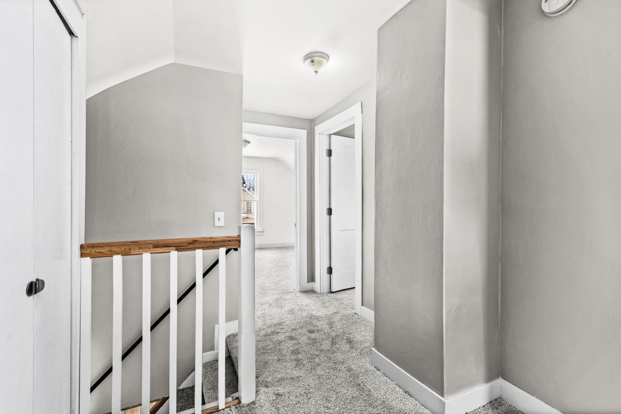 310 3rd Street Cloquet, MN 55720 - Photo 32 of 39 Hall with light carpet and lofted ceiling