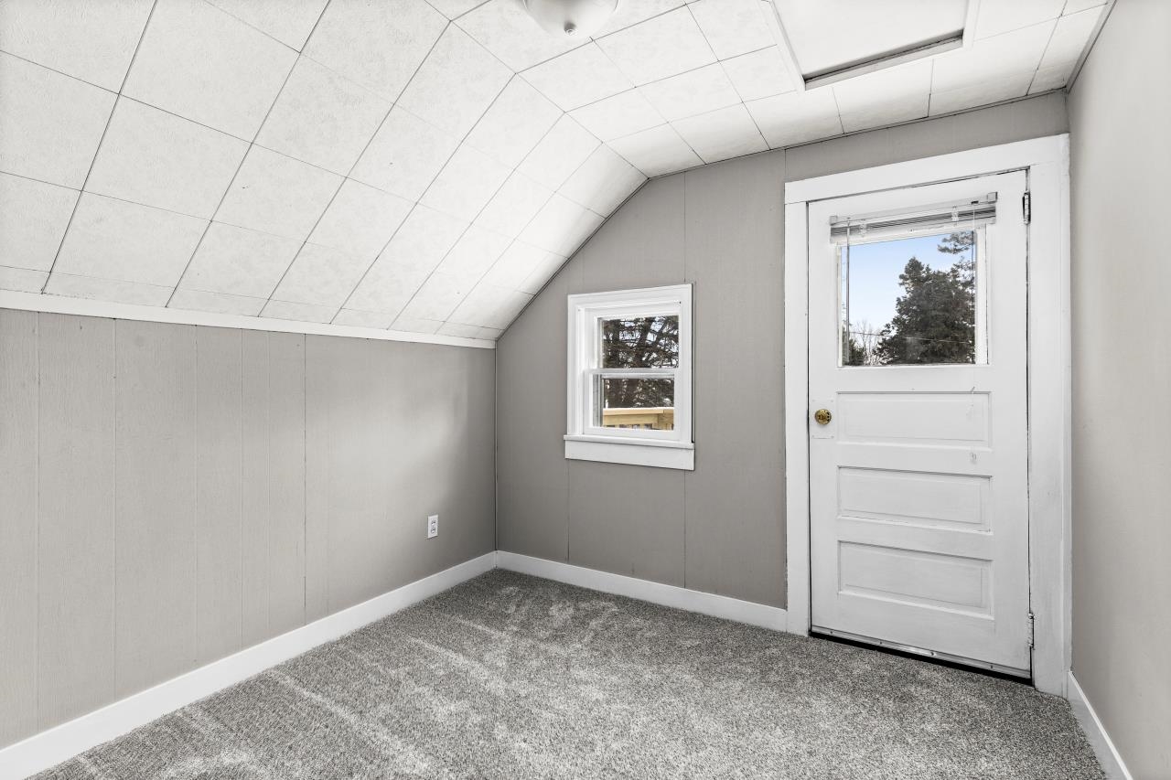 310 3rd Street Cloquet, MN 55720 - Photo 35 of 39 Additional living space with carpet floors and vaulted ceiling
