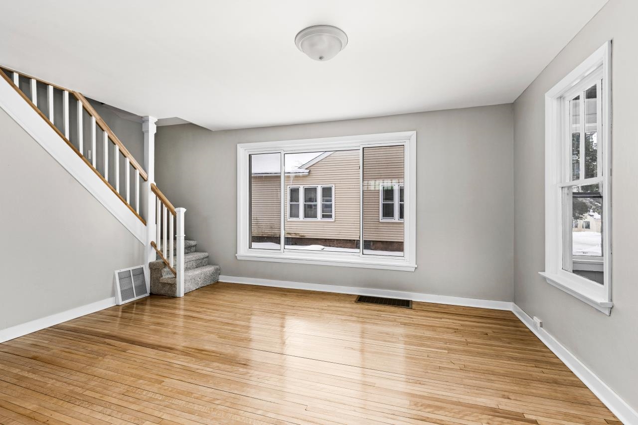 310 3rd Street Cloquet, MN 55720 - Photo 6 of 39 Empty room featuring stairway and light wood-style floors