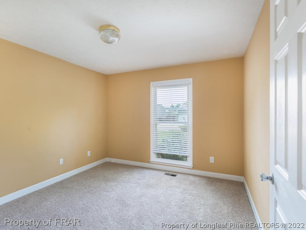 218 Larchmont Road Fayetteville, NC 28311 - Photo 17 of 28 an empty room with windows
