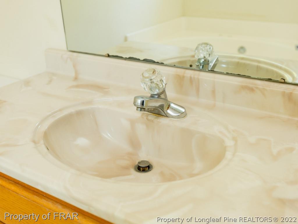 218 Larchmont Road Fayetteville, NC 28311 - Photo 25 of 28 a bathroom with a tub
