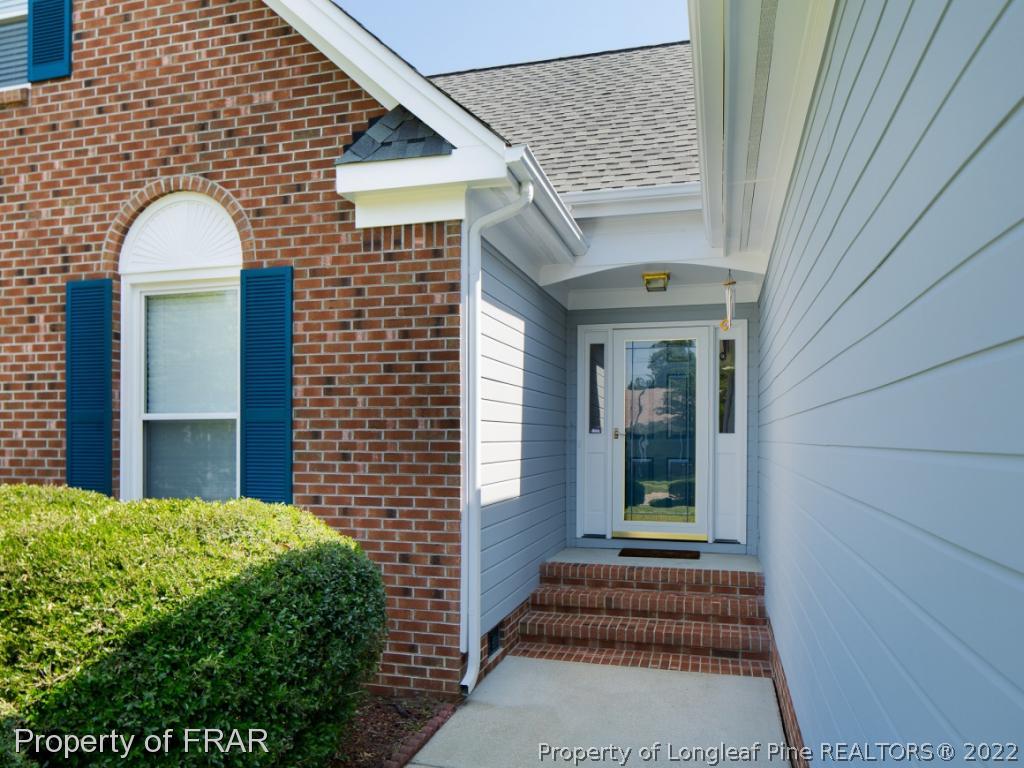 218 Larchmont Road Fayetteville, NC 28311 - Photo 3 of 28 a view of a brick house with a large windows