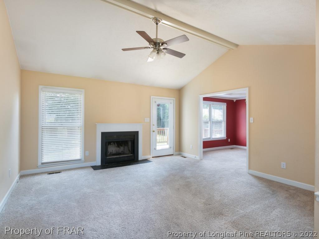 218 Larchmont Road Fayetteville, NC 28311 - Photo 5 of 28 a view of a livingroom with a fireplace and window