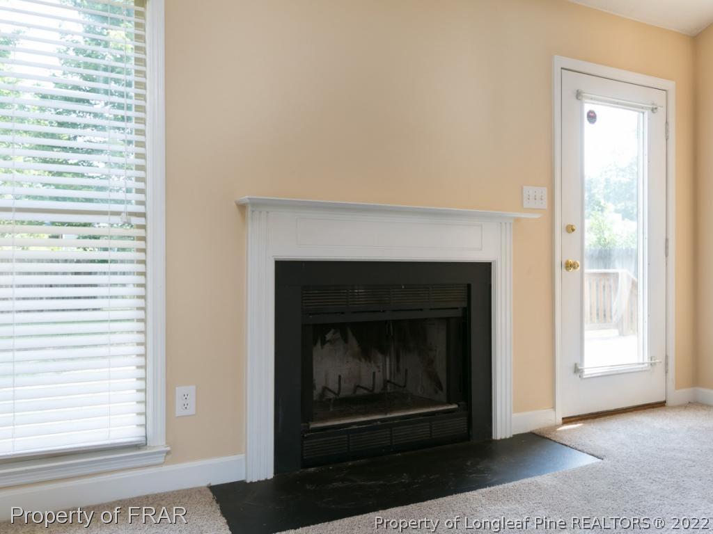 218 Larchmont Road Fayetteville, NC 28311 - Photo 6 of 28 a living room with a fireplace