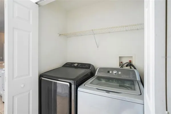 a utility room with dryer and washer