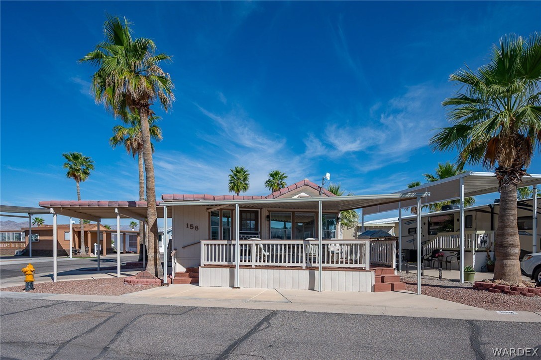 2000 Ramar Road, Unit 158 Bullhead City, AZ 86442 - Photo 4 of 78 Prime location within Riverview RV Resort? surrounded by mountain views, palm-lined streets, and a vibrant active lifestyle community.