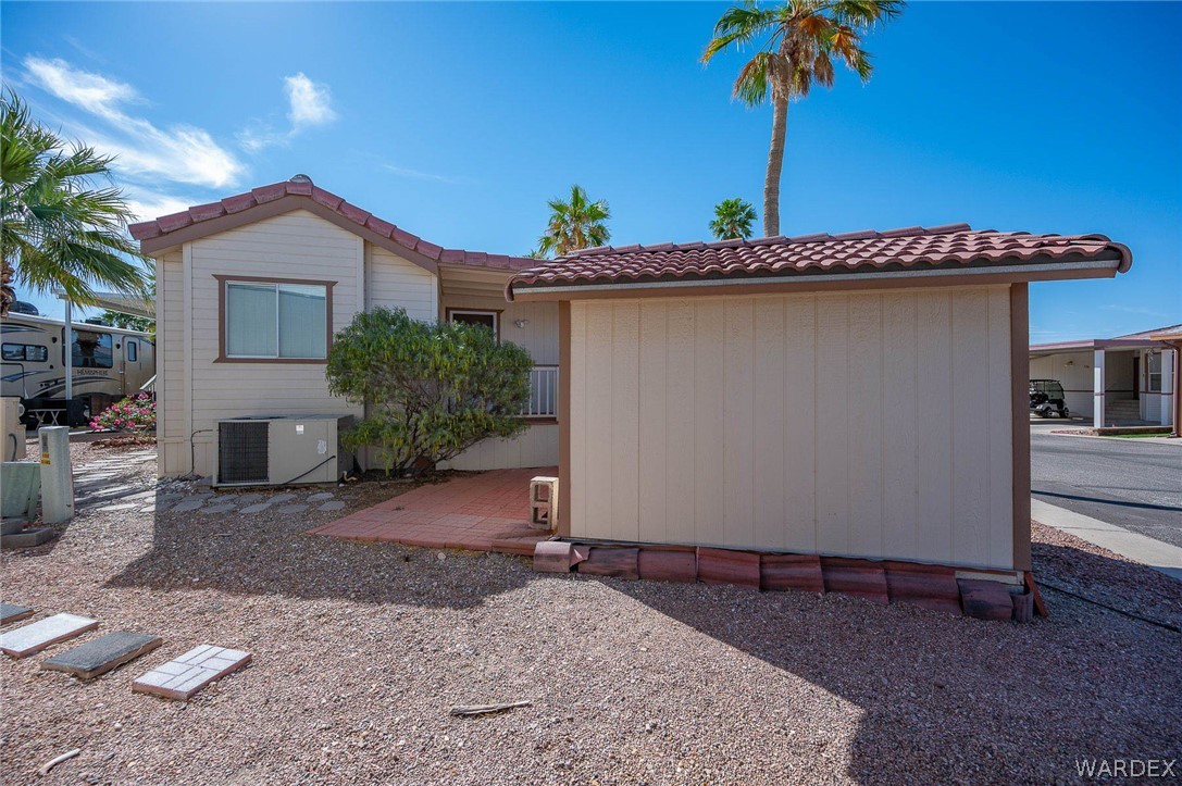 2000 Ramar Road, Unit 158 Bullhead City, AZ 86442 - Photo 47 of 78 Private outdoor area with detached shed and patio space? providing both storage and usability.