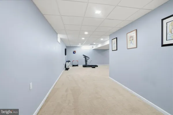 a large room with painting on the wall