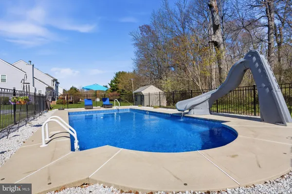 a view of a swimming pool with a patio
