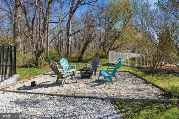 a view of a bench in a backyard